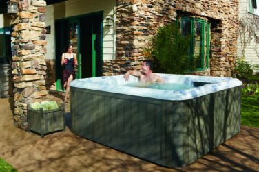 Man and Woman Outside Relaxing in Hot Tub