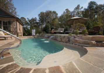 Concrete pool with waterfall - Dave Severance