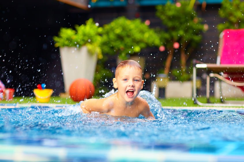 rising sun pools excited happy kid boy jumping in pool, water fun