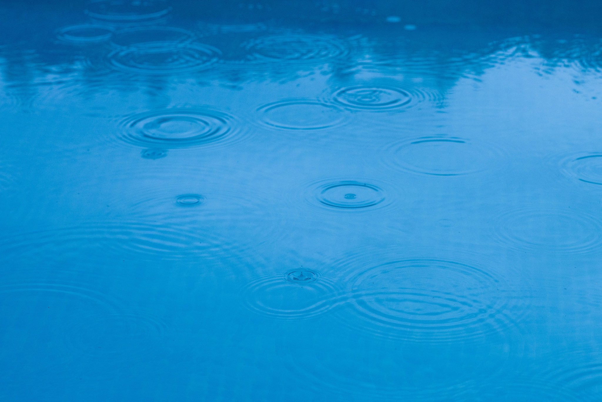 Raindrops Falling on a Pool - Rising Sun Pools & Spas