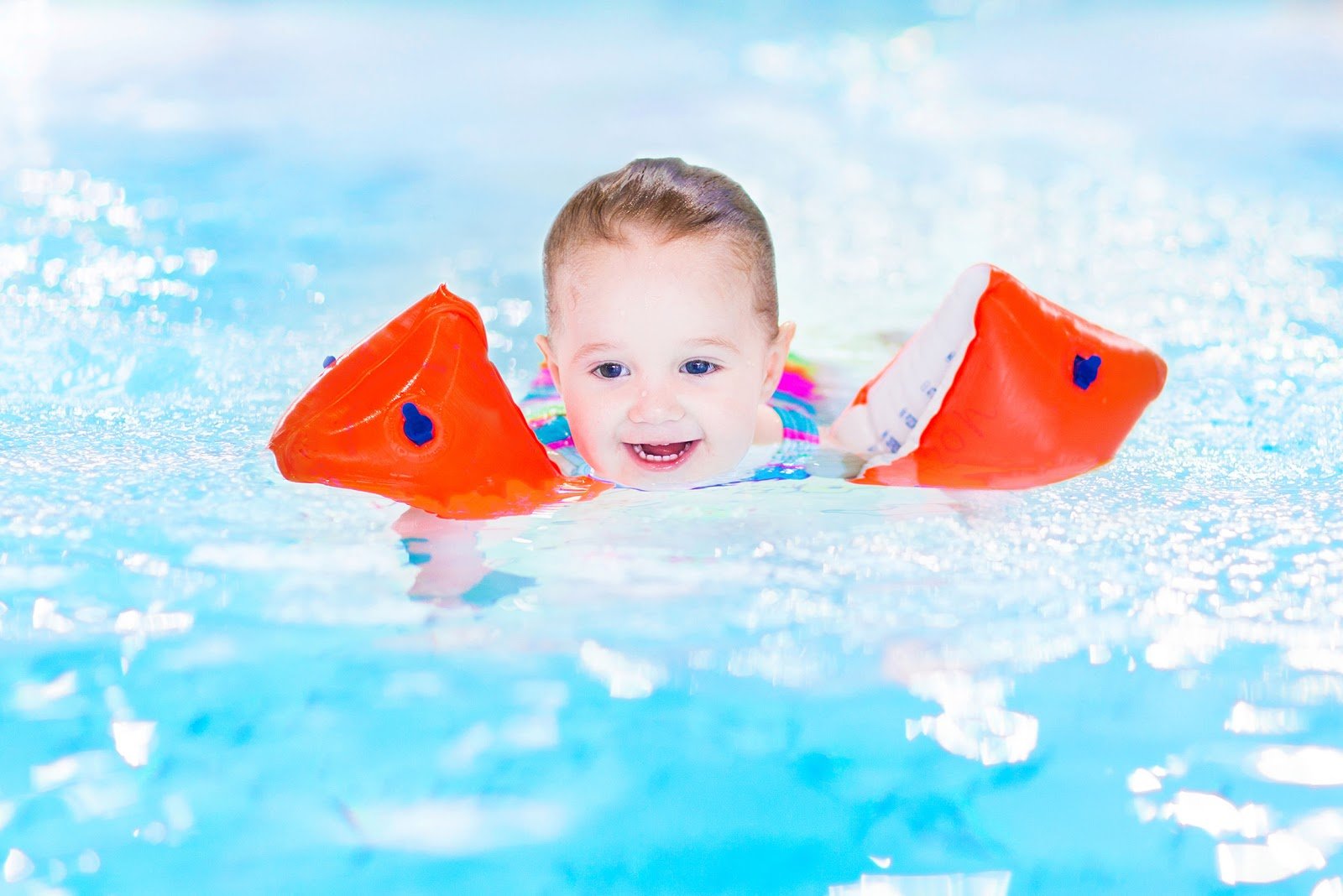 Toddler Using Floaties in Pool - Rising Sun Pools & Spas
