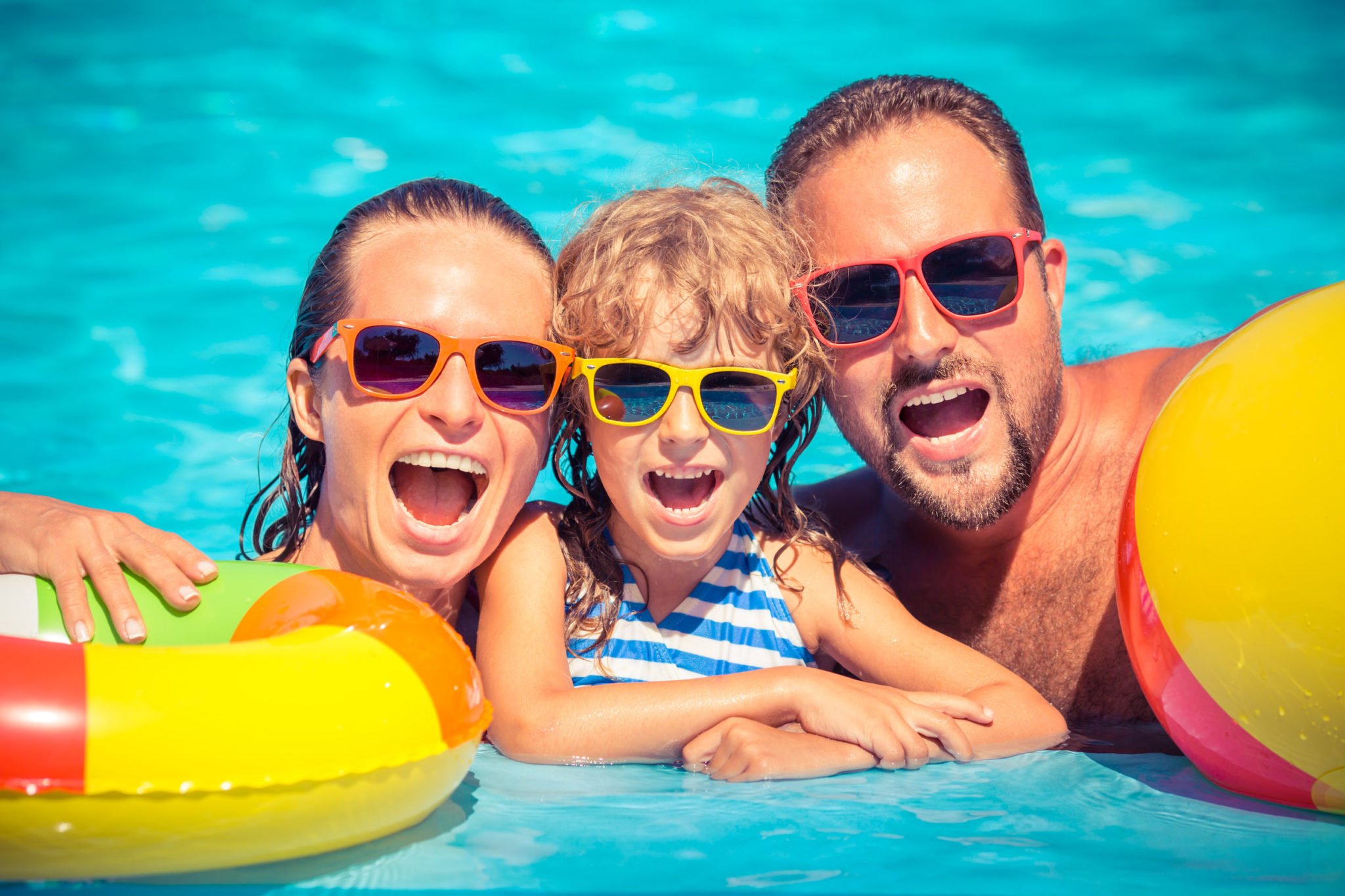 Happy Family in Swimming Pool | Rising Sun Pools & Spas