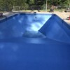 Empty rectangular pool with diving board