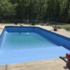 Empty rectangular pool with diving board